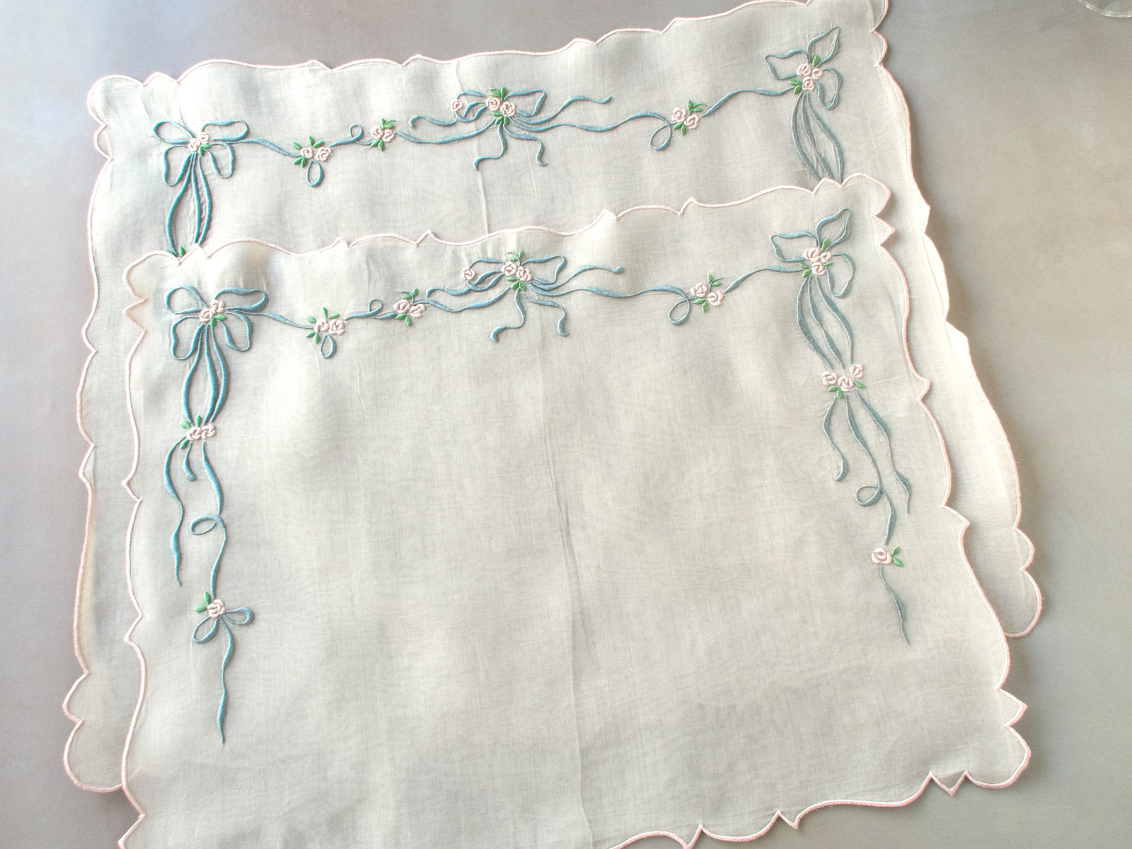 Vintage Marghab “Queen Victoria” pillow cover hand embroidered in Madeira, featuring raised ribbons and roses on fine organdy — elegant, detailed, and in excellent condition.