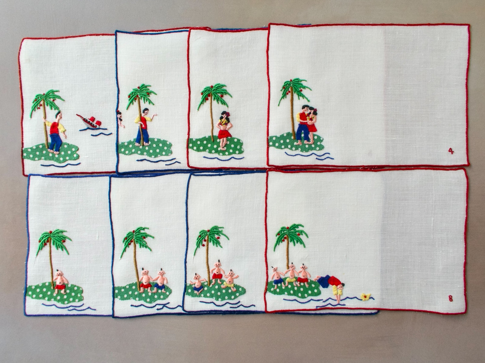 Eight vintage Madeira cocktail napkins showing a tropical island love story embroidered in bright colors.