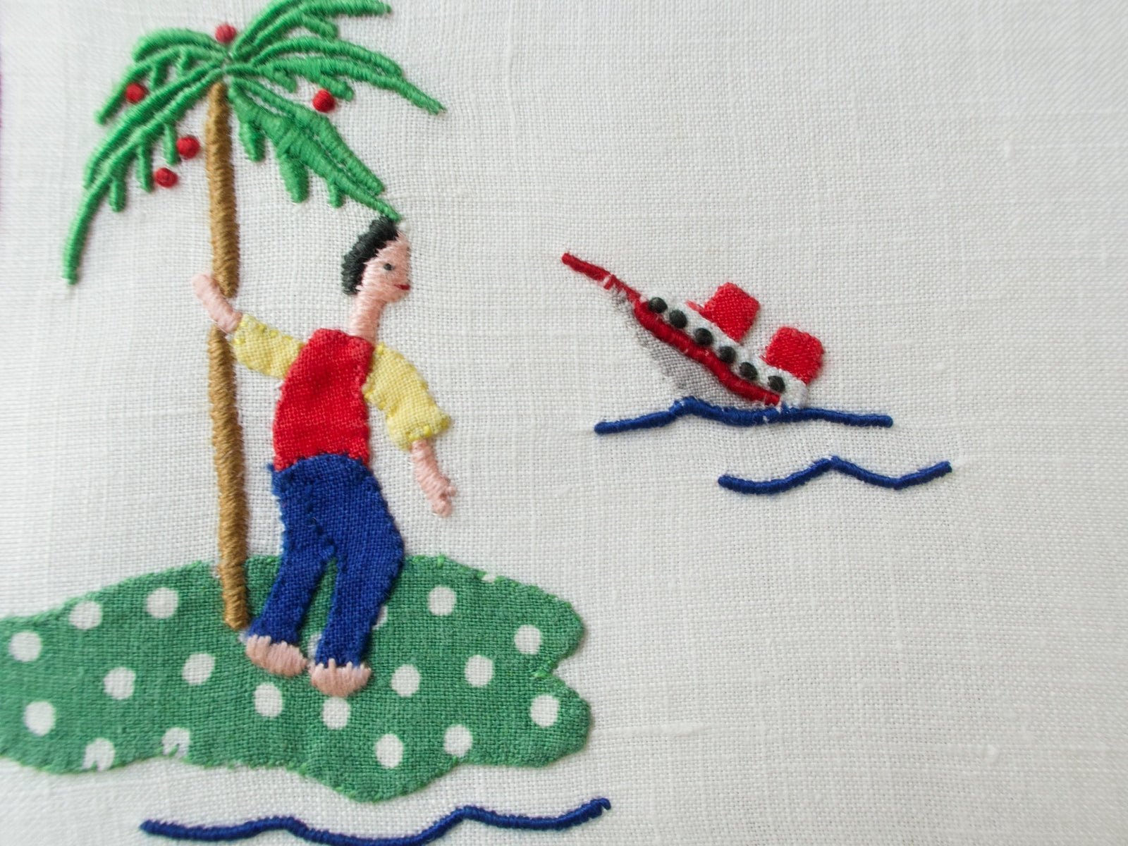 Shipwreck scene with palm trees and ocean waves on Madeira embroidered cocktail napkin.