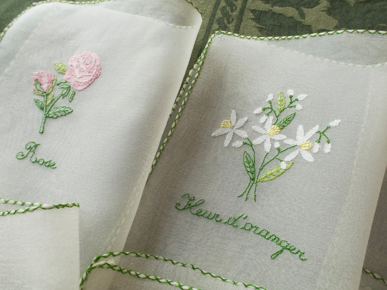 Vintage silk chiffon cocktail napkins hand embroidered with French flower names and delicate floral motifs.