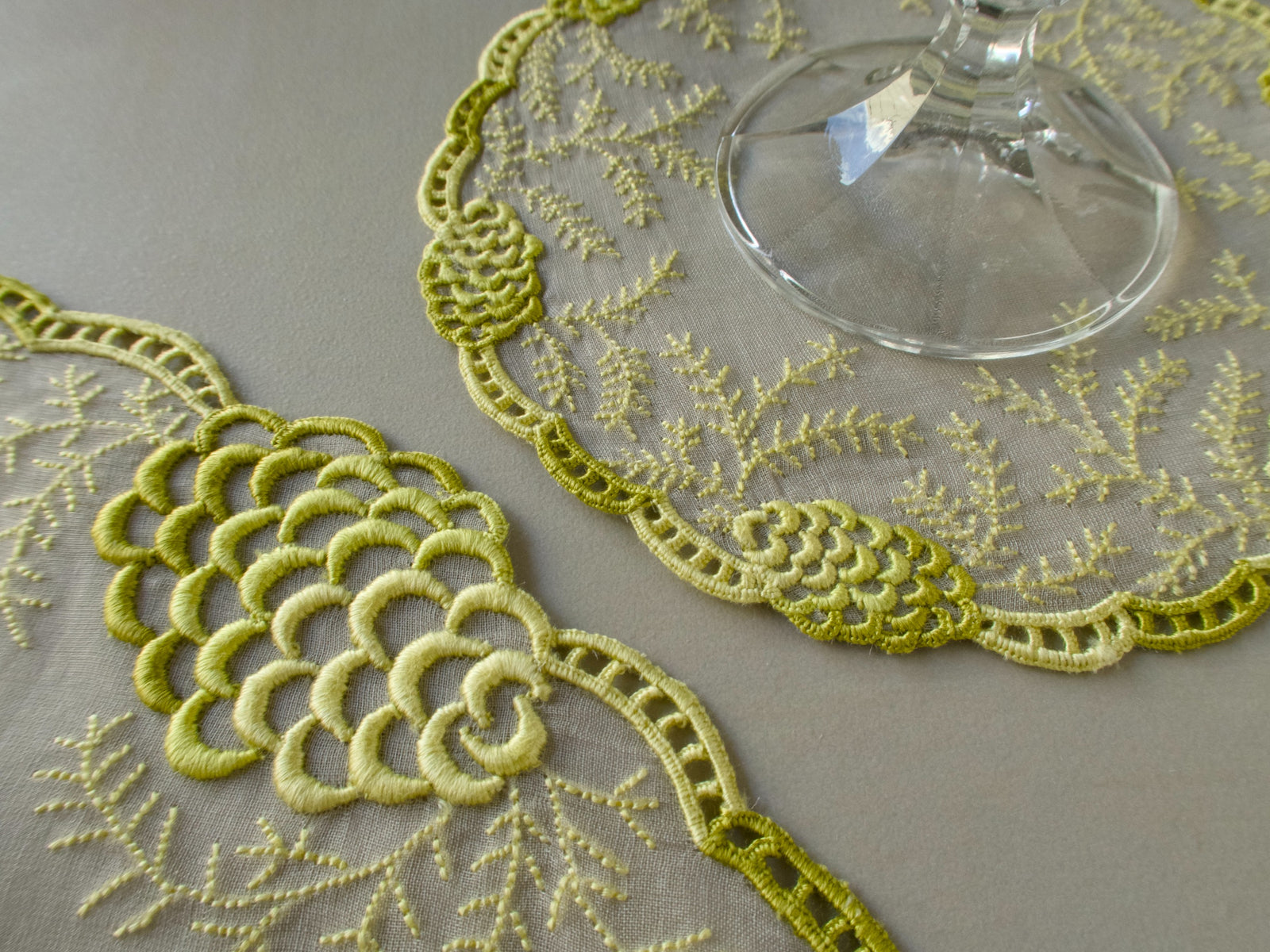 Vintage Marghab "Pine Cones" placemat with pine cone motif beside a wine glass