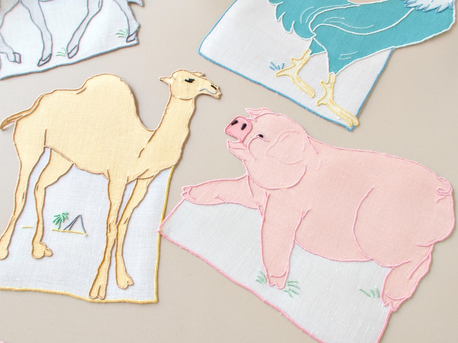 Vintage Madeira hand embroidered cocktail napkins, yellow camel and pink pig silhouettes, fine linen