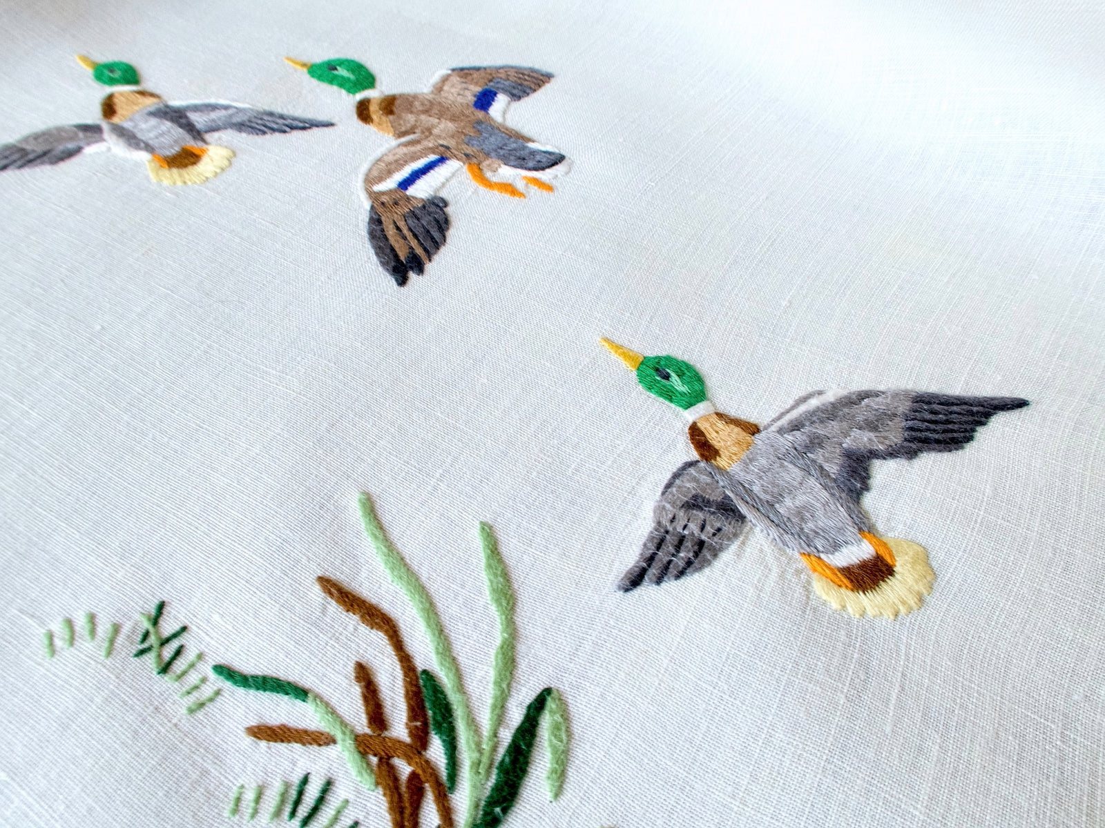 Vintage Madeira tablecloth embroidered with colorful mallards in flight and among marsh grasses