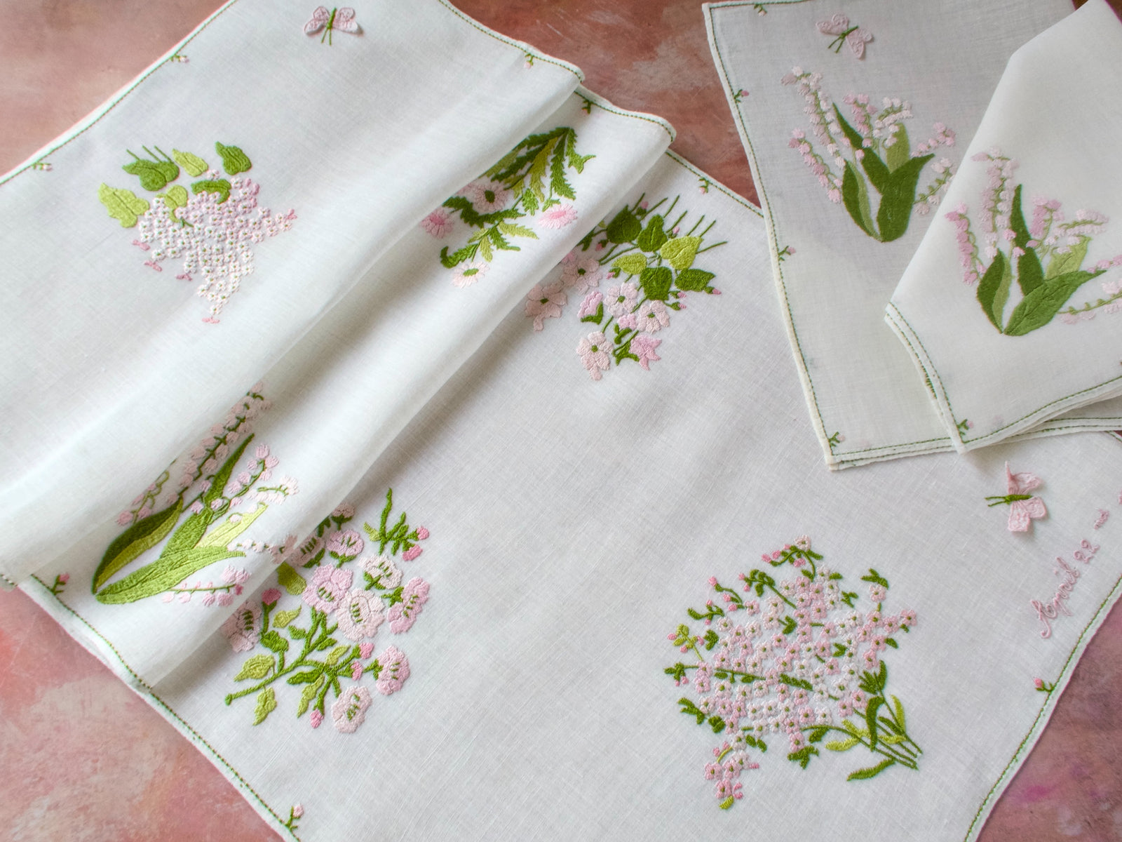 Rapisardi table runner embroidered “April 22, 1966,” likely a wedding date, with pink floral motif and trembler butterfly.