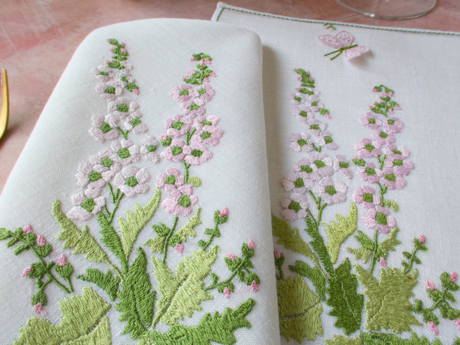 Baroness Rapisardi floral placemats in rare pink, varied botanical motifs with raised punto stuioia embroidery.