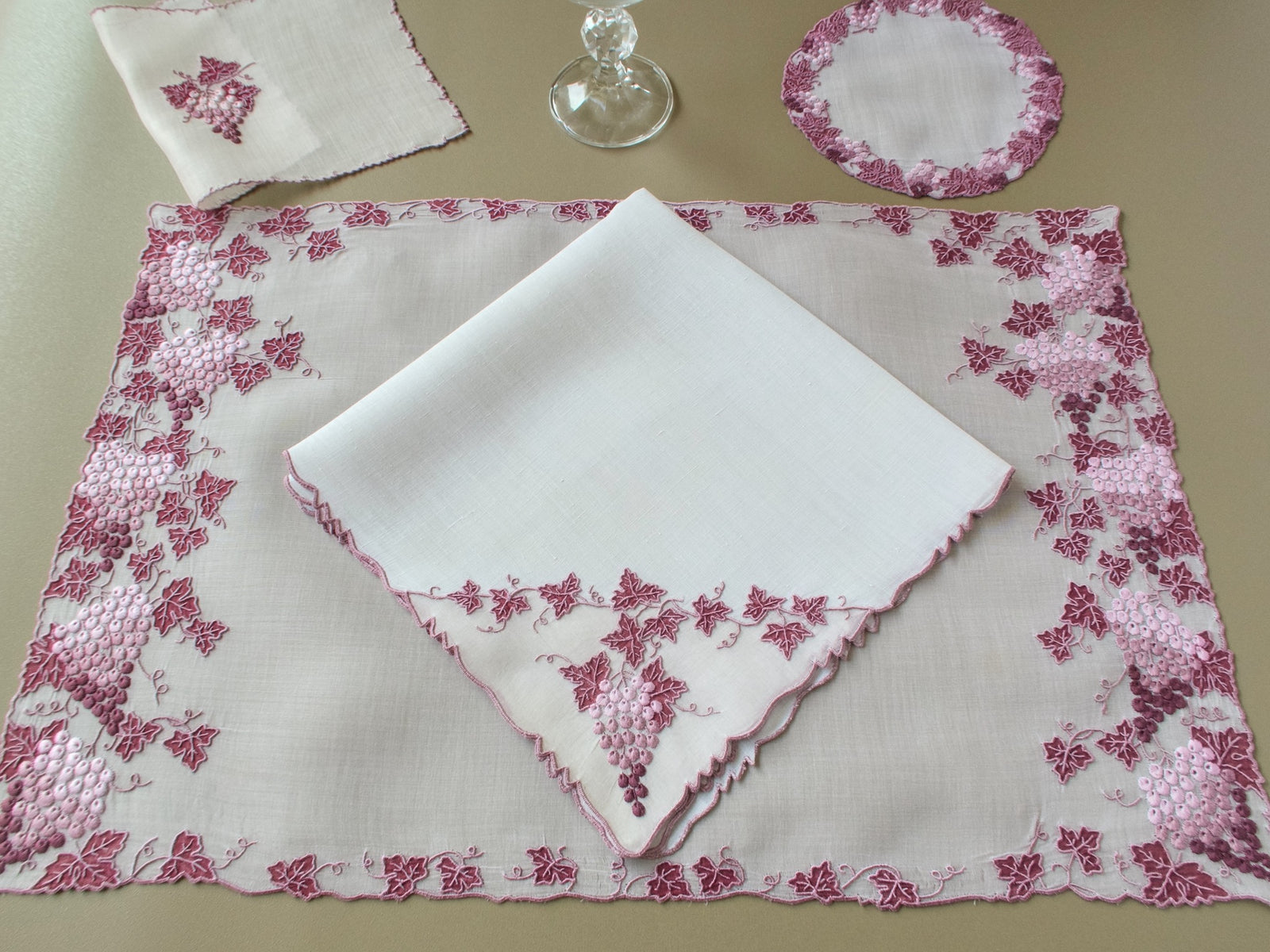 Vintage Marghab Vineyard place setting with placemat, napkin, coaster, cocktail napkin and crystal glass
