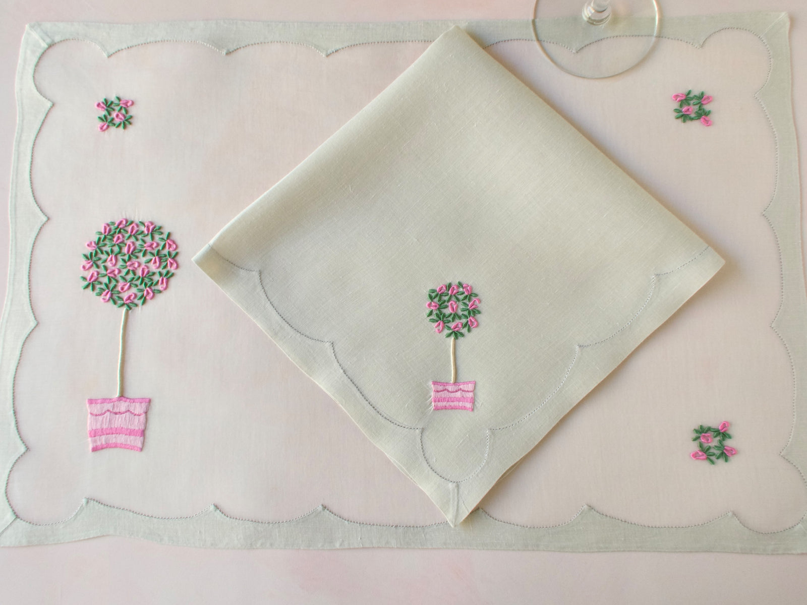 16 piece Madeira placemat set with embroidered rose topiary design on organdy and linen.