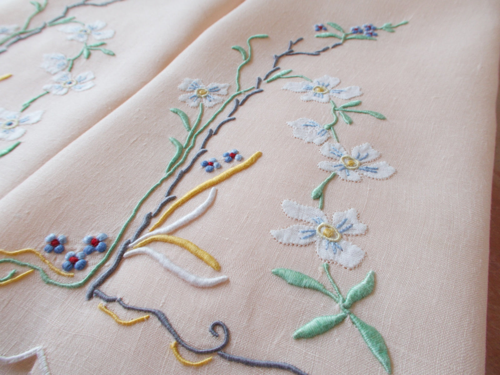 Embroidered flowers on vintage linen towels