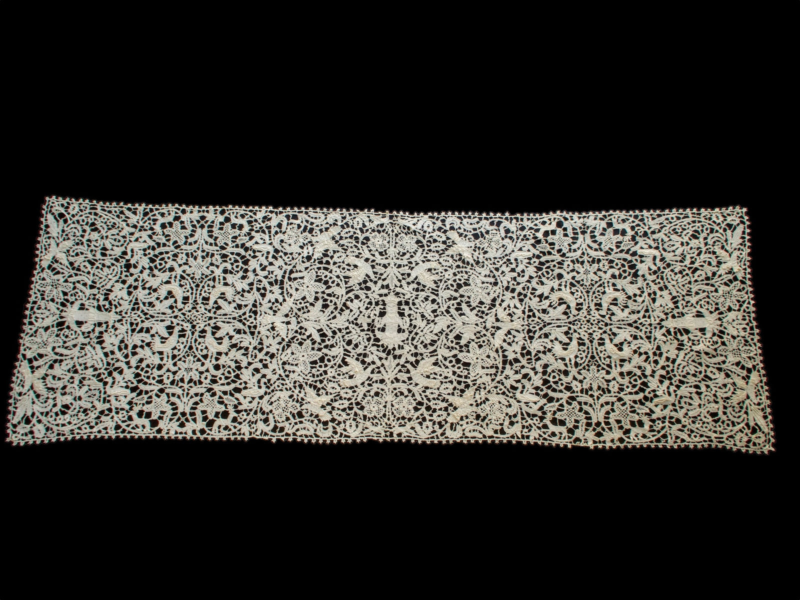 Vintage Italian bobbin lace runner featuring animals, birds and figures