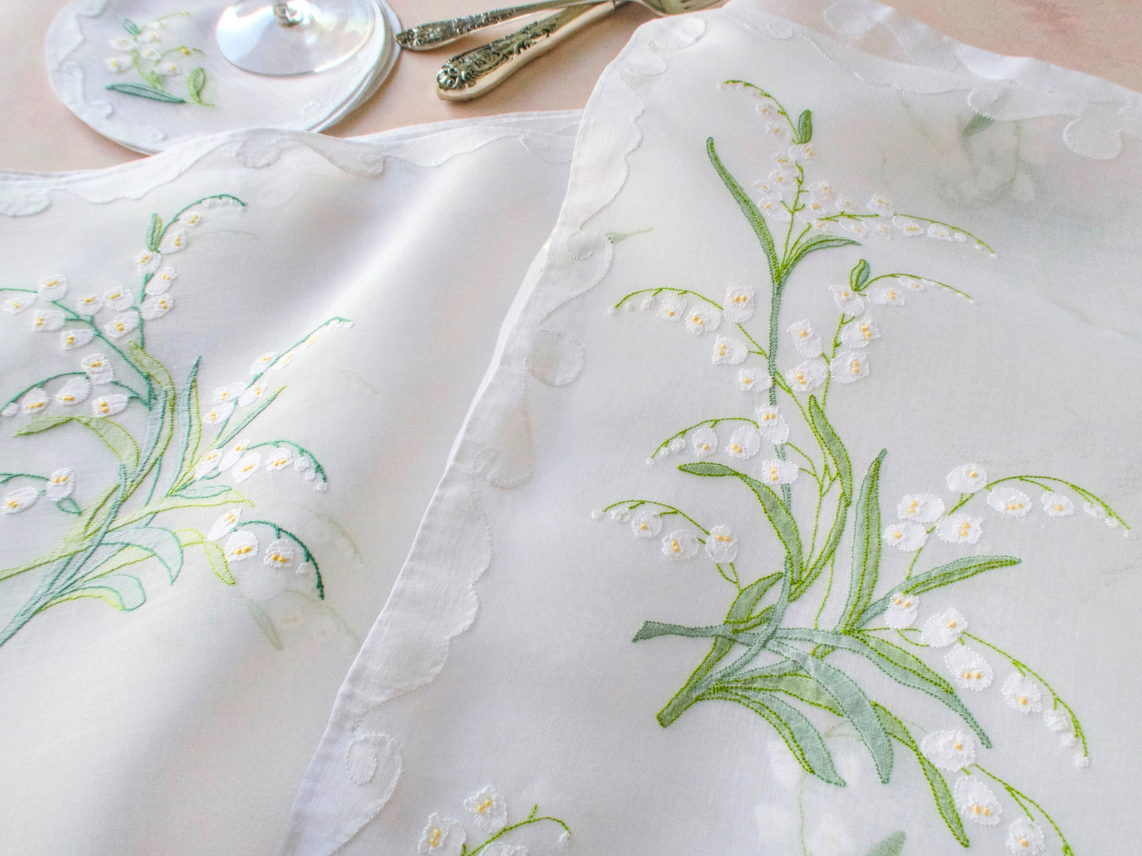 Embroidery details from a Lily of the Valley Madeira placemat set for twelve.