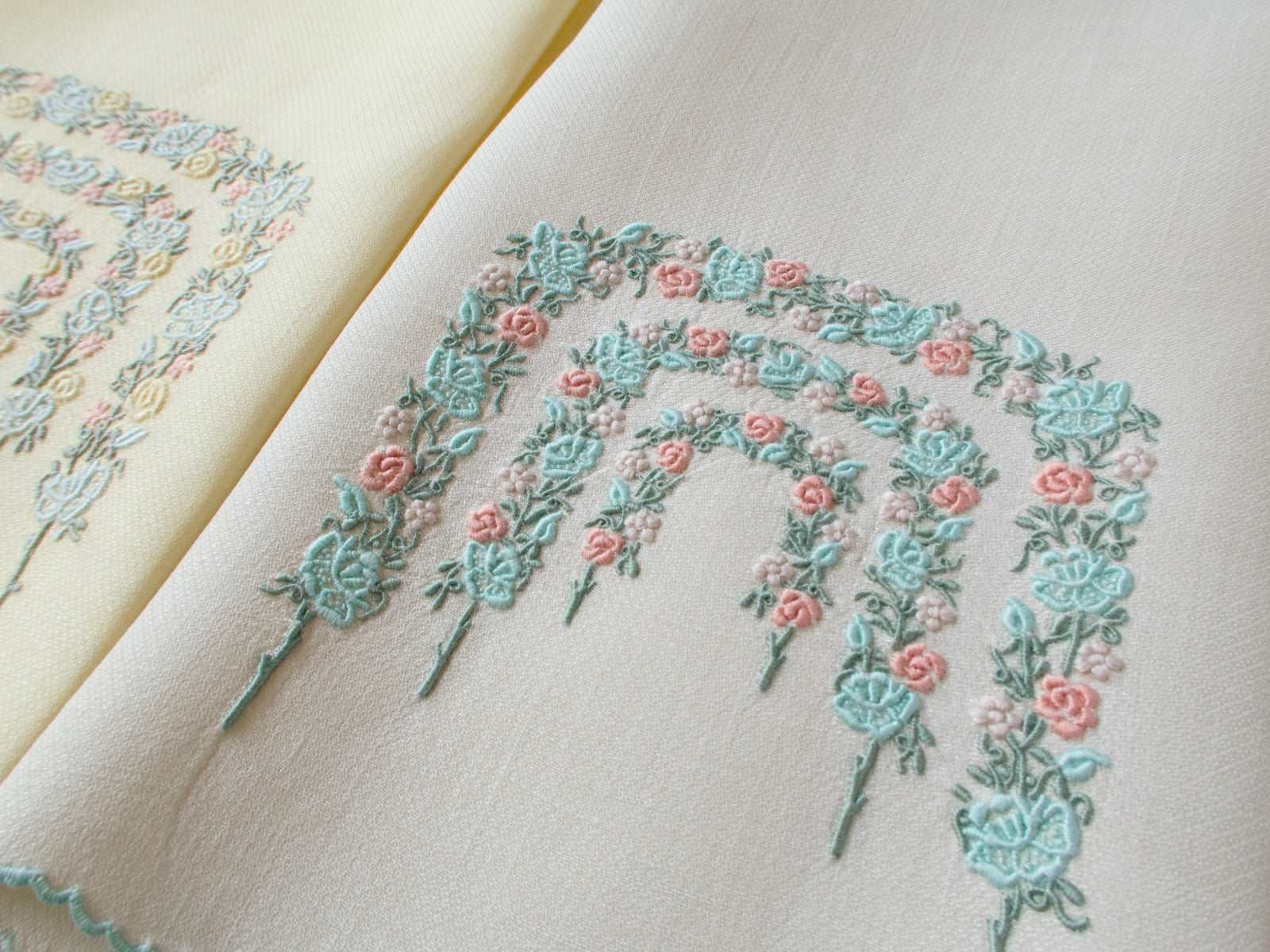 Closeup of two vintage Marghab guest towels displaying Rose Arbor pattern in complementary colorways.