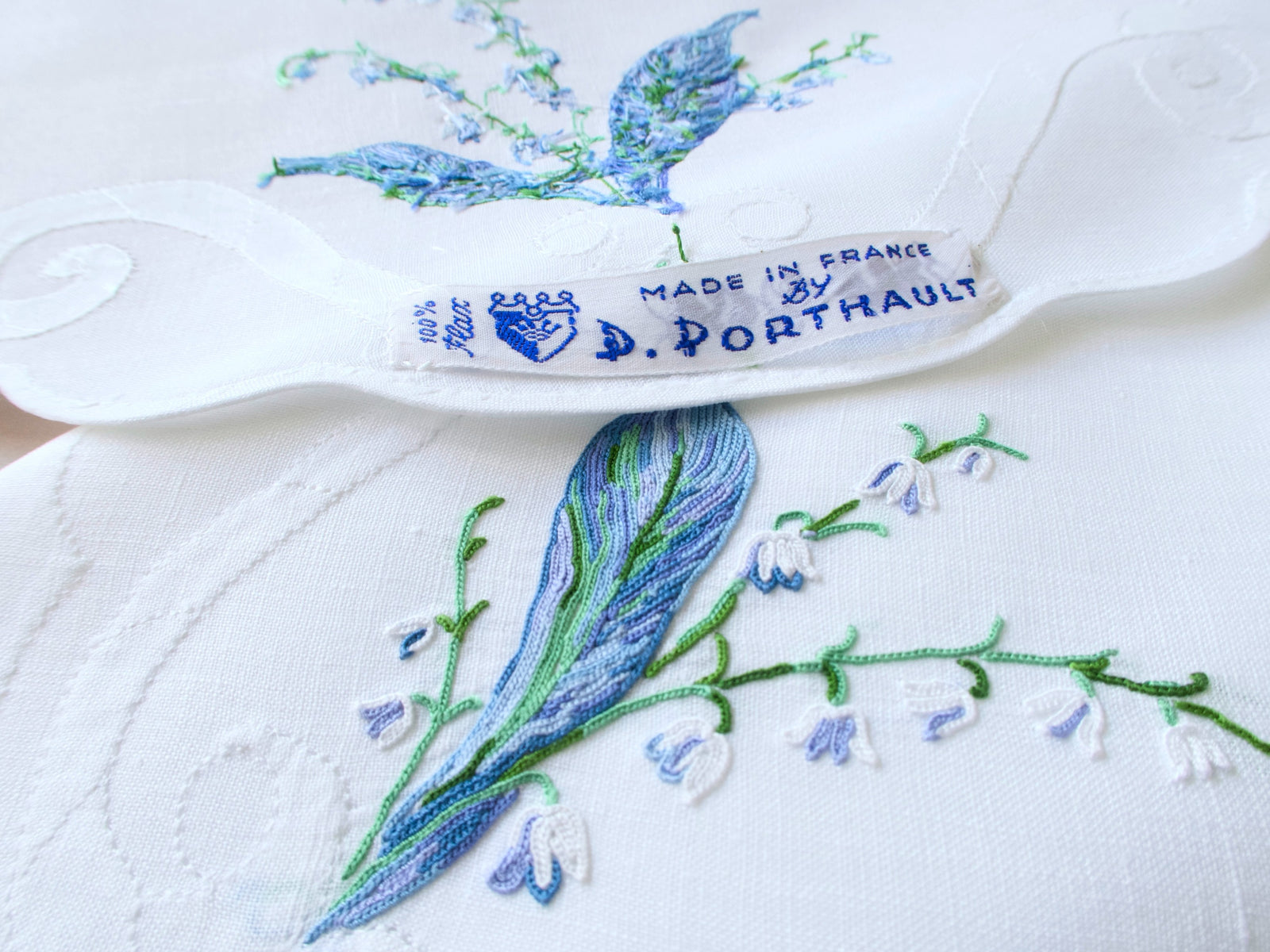 D. Porthault label on vintage linen showing Made in France authentication mark.