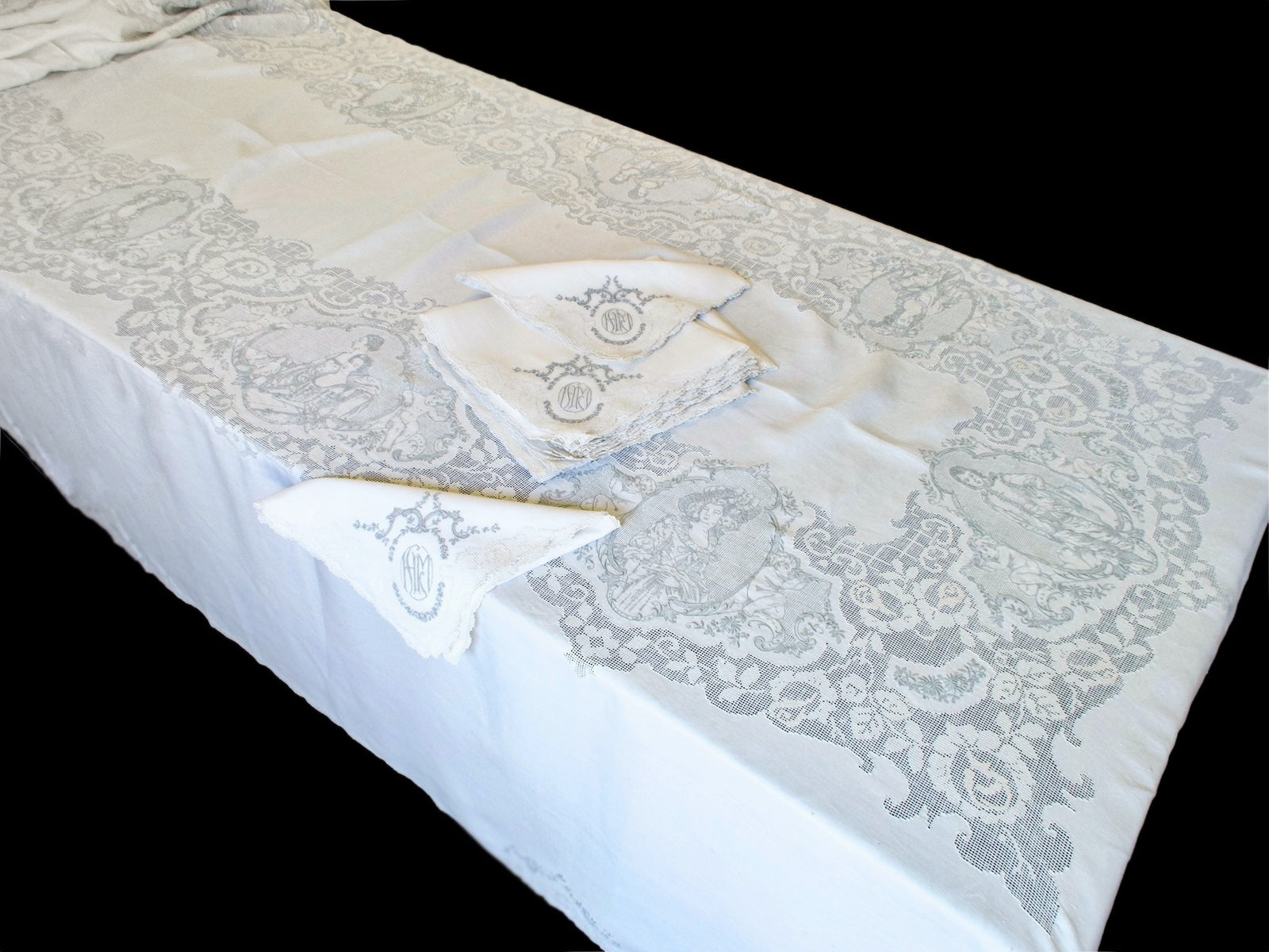 Gainsborough Appenzell linen tablecloth 72x140 inches full length view with napkins, black background