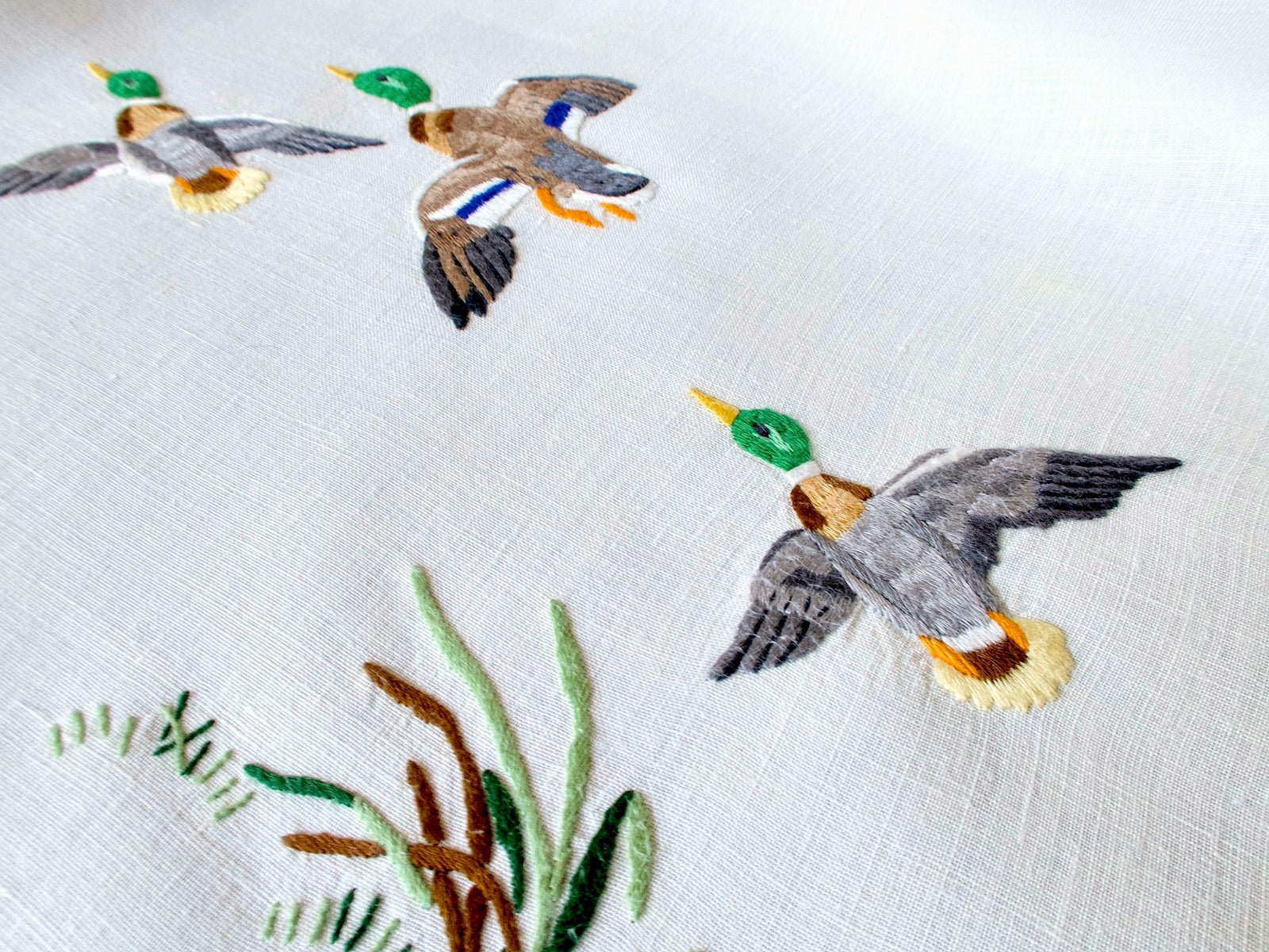 Vintage Madeira tablecloth embroidered with colorful mallards in flight and among marsh grasses