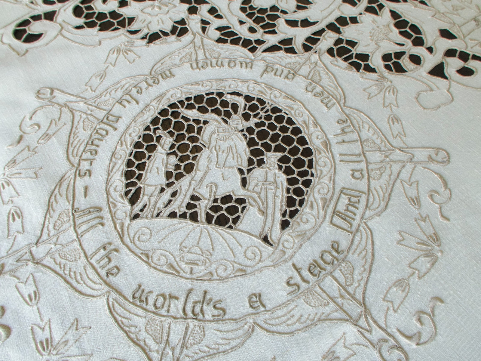 Vintage Madeira tablecloth with hand-embroidered Shakespeare scenes. All the world's a stage.