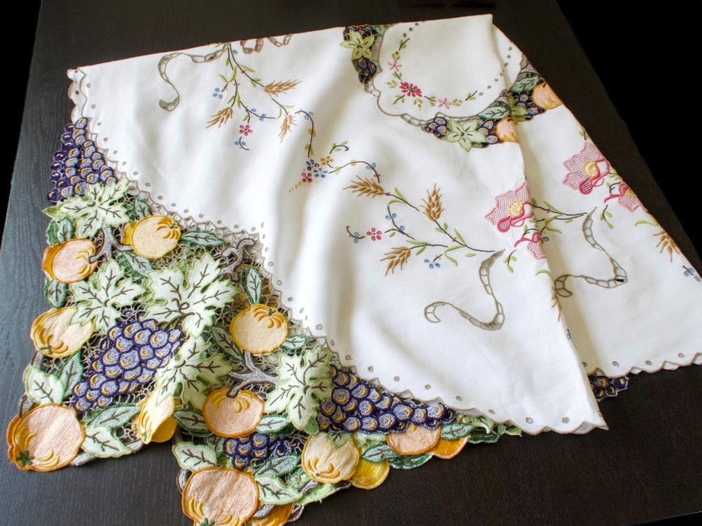 Full vintage Madeira linen tablecloth with cutwork pumpkins and grapes in the corners, a scalloped center wreath, wheat and blossoms