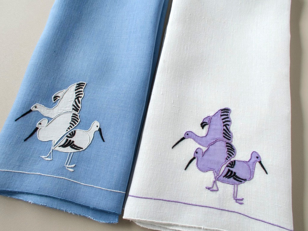 Vintage coordinating hand towels, set of 2, modernist water birds in appliqué, one white linen and one blue linen, mid-century design.