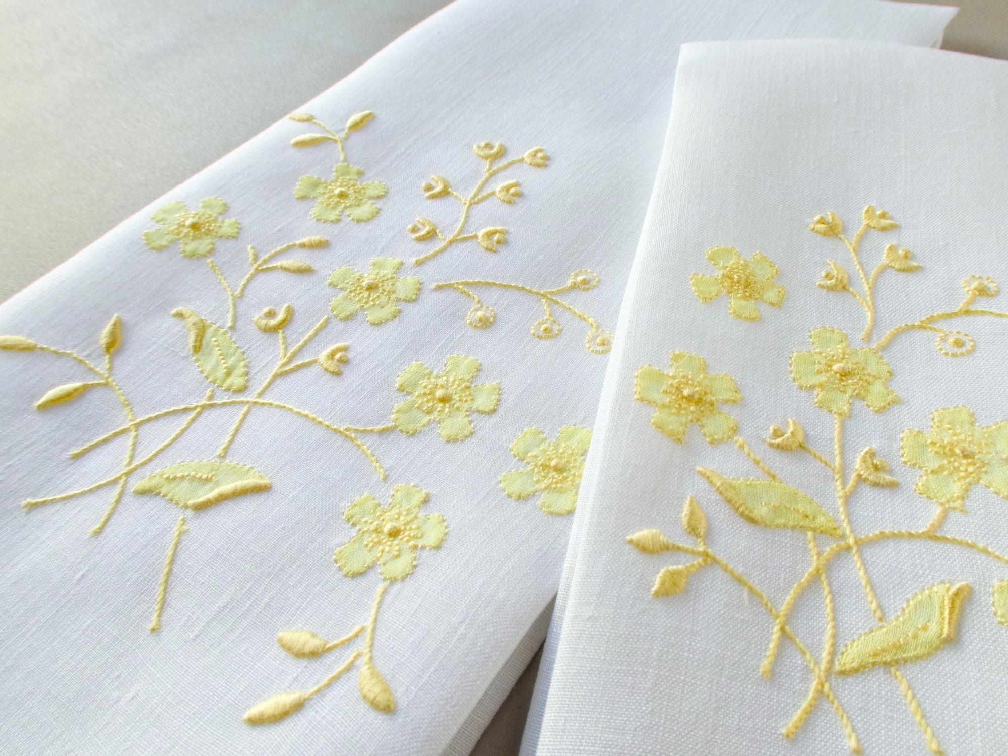 Vintage Marghab linen towels in the “Spray” pattern, hand embroidered in yellow on white linen.