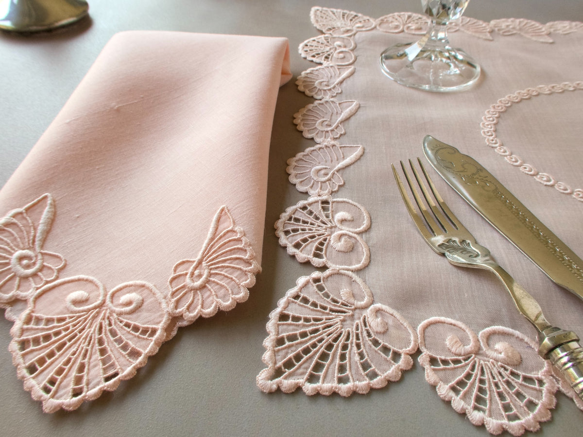 Vintage Marghab “Shell” placemat and napkin set in soft pink organdy and linen, hand embroidered in Madeira with sculptural shell motifs and intricate scalloped borders.
