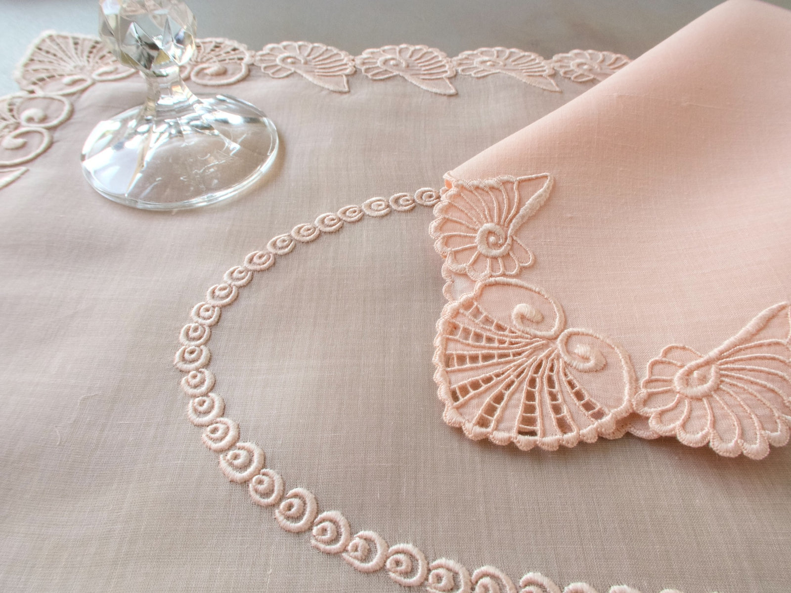 Vintage Marghab “Shell” placemat and napkin set in soft pink organdy and linen, hand embroidered in Madeira with sculptural shell motifs and intricate scalloped borders.