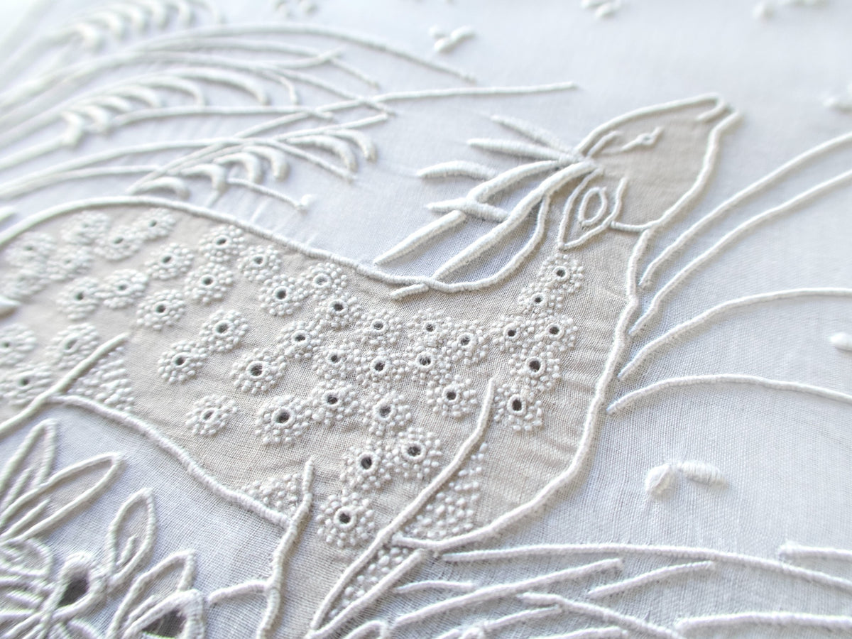 Vintage Marghab "Deer" placemat close-up of the deer's head and eyelet-dotted body in raised embroidery