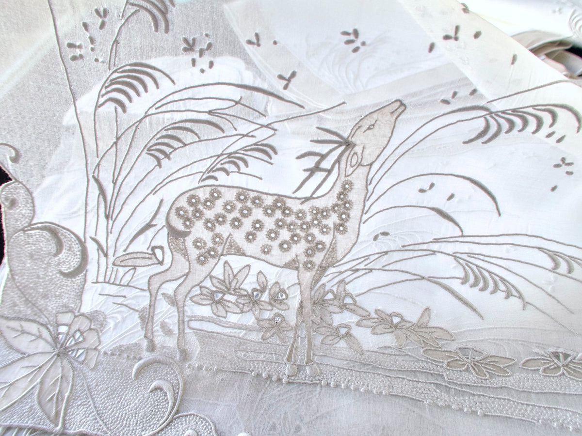 Vintage Marghab "Deer" placemat lifted to show the sheer organdy and embroidered deer