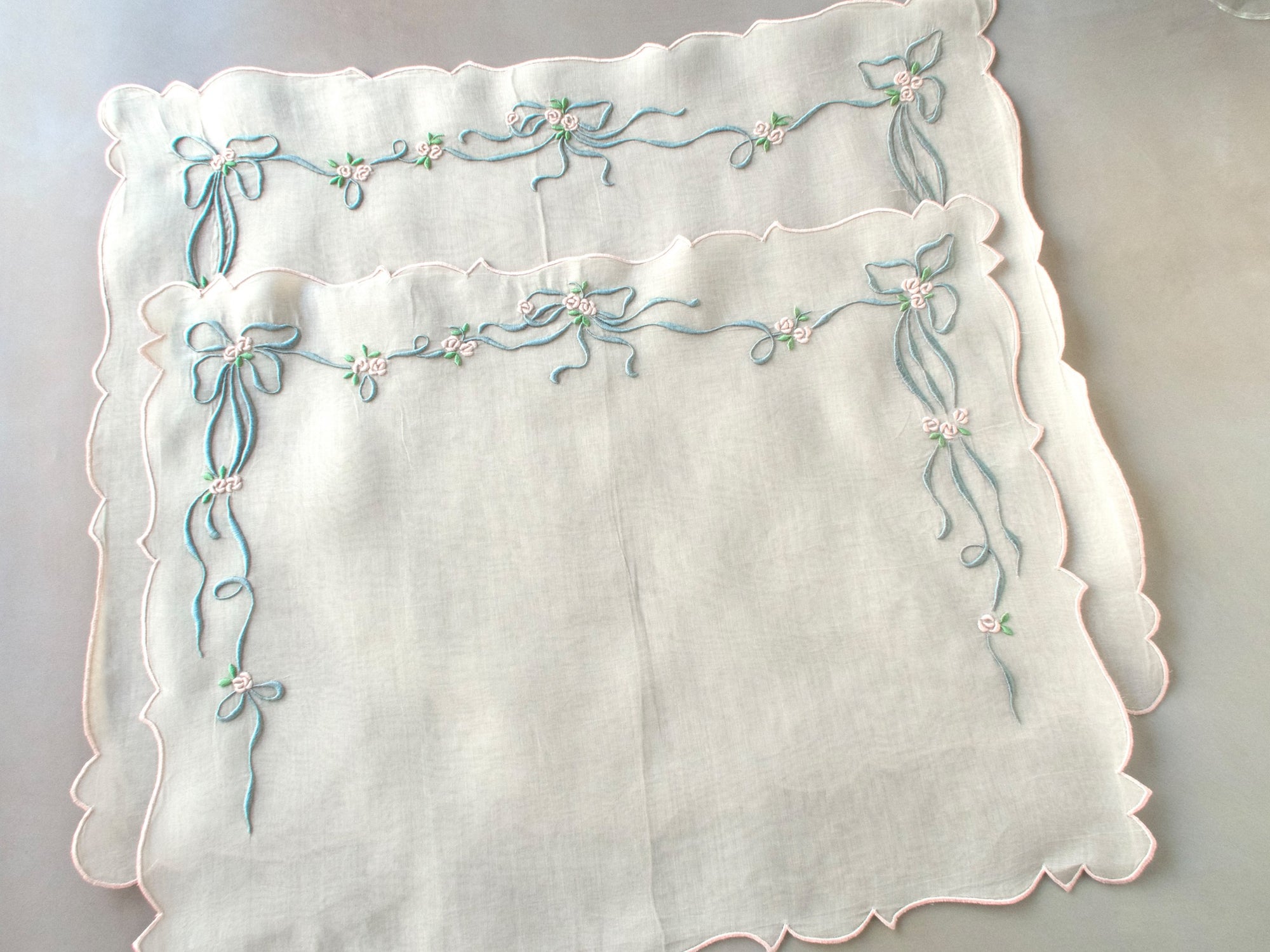 Vintage Marghab “Queen Victoria” pillow cover hand embroidered in Madeira, featuring raised ribbons and roses on fine organdy — elegant, detailed, and in excellent condition.