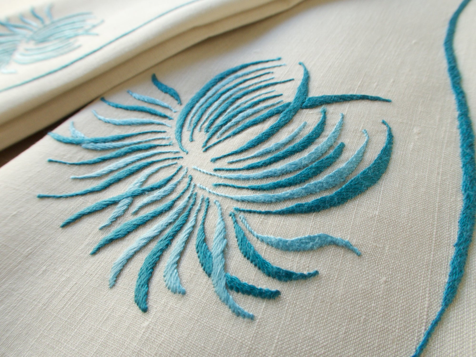 Marghab “Chrysanthemum” linen towel set with two guest towels and one fingertip towel, finely embroidered in Madeira in a graceful floral design.