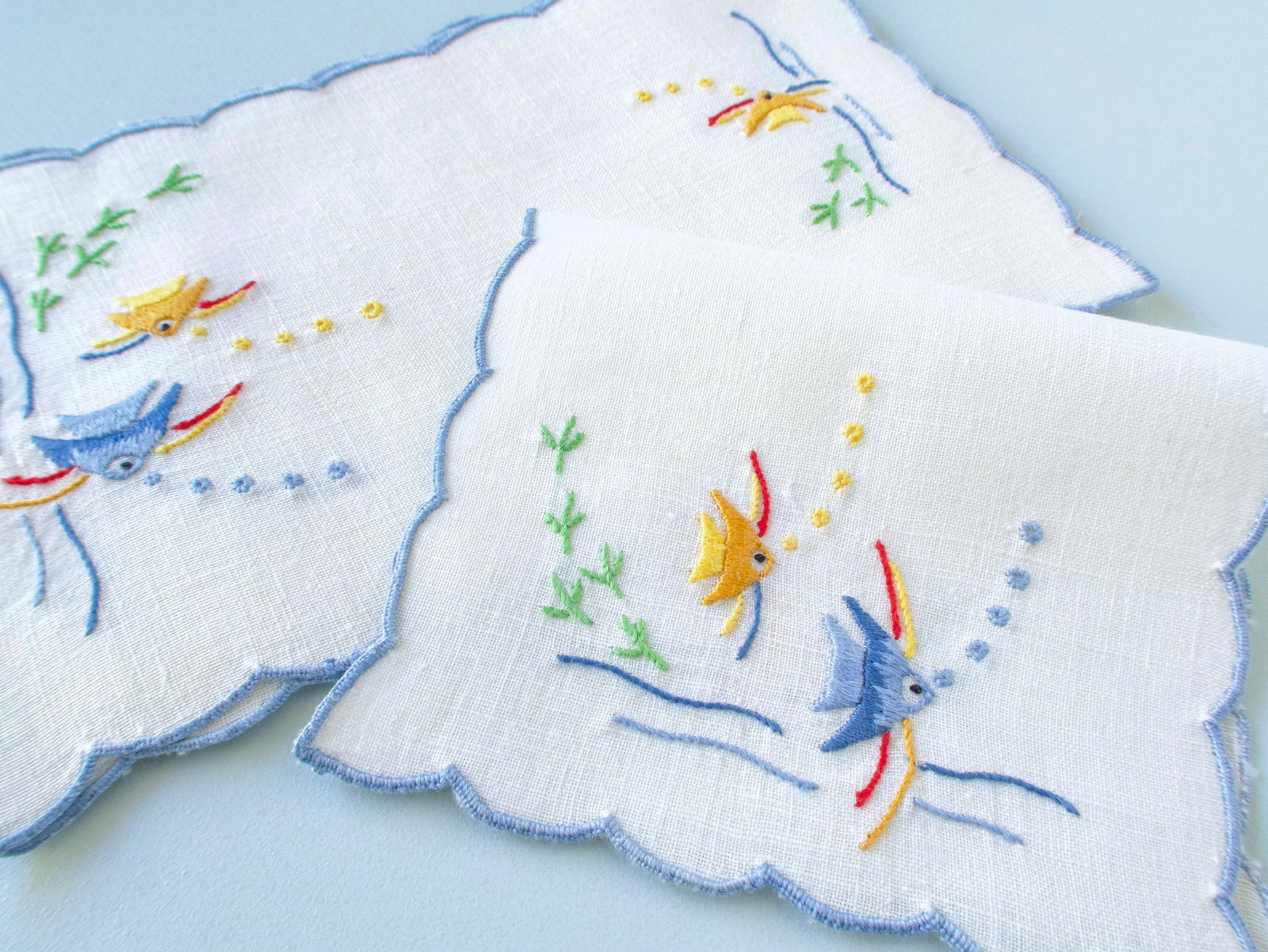 Vintage hand embroidered cocktail napkins, set of 6, yellow and blue angelfish with bubbles and seaweed on white linen, scalloped edges.