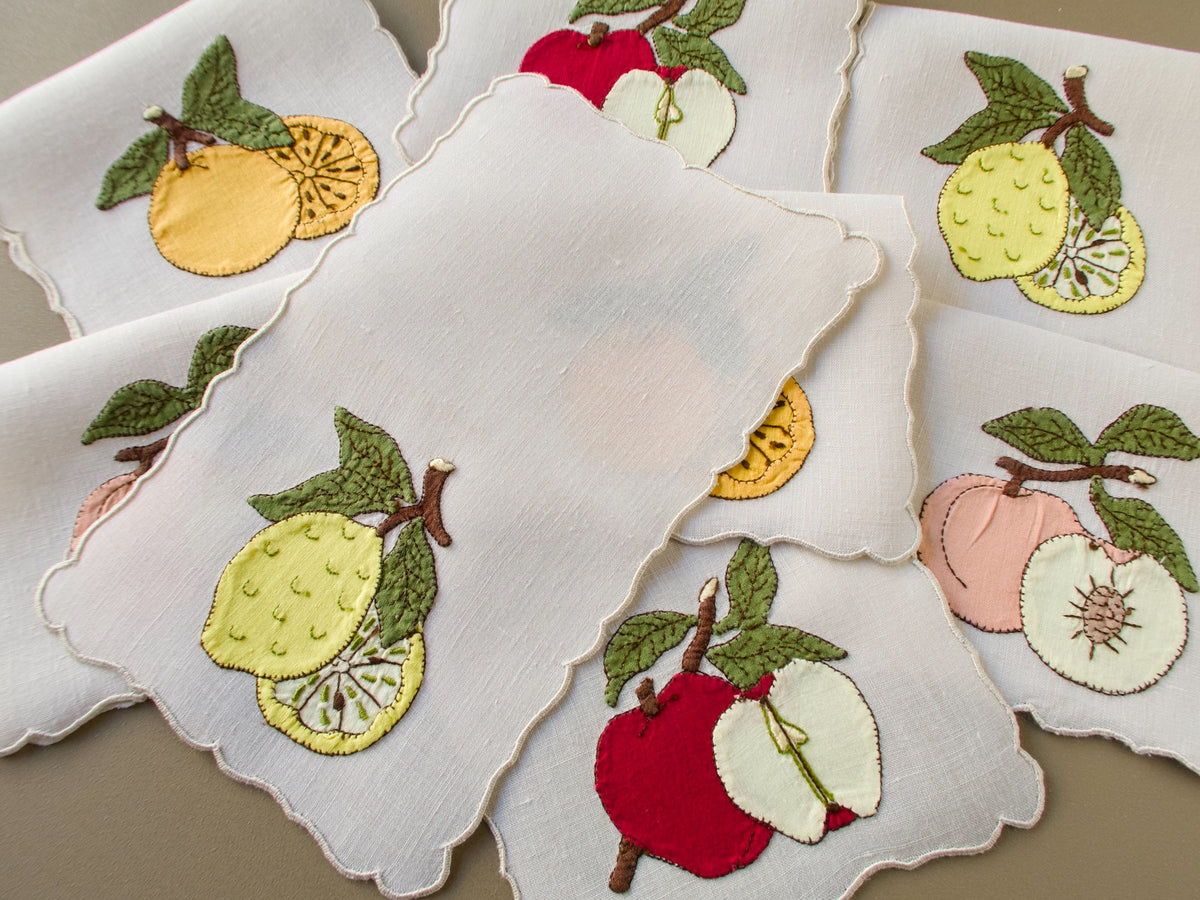 Set of eight vintage Madeira cocktail napkins with appliqué fruits and scalloped edges