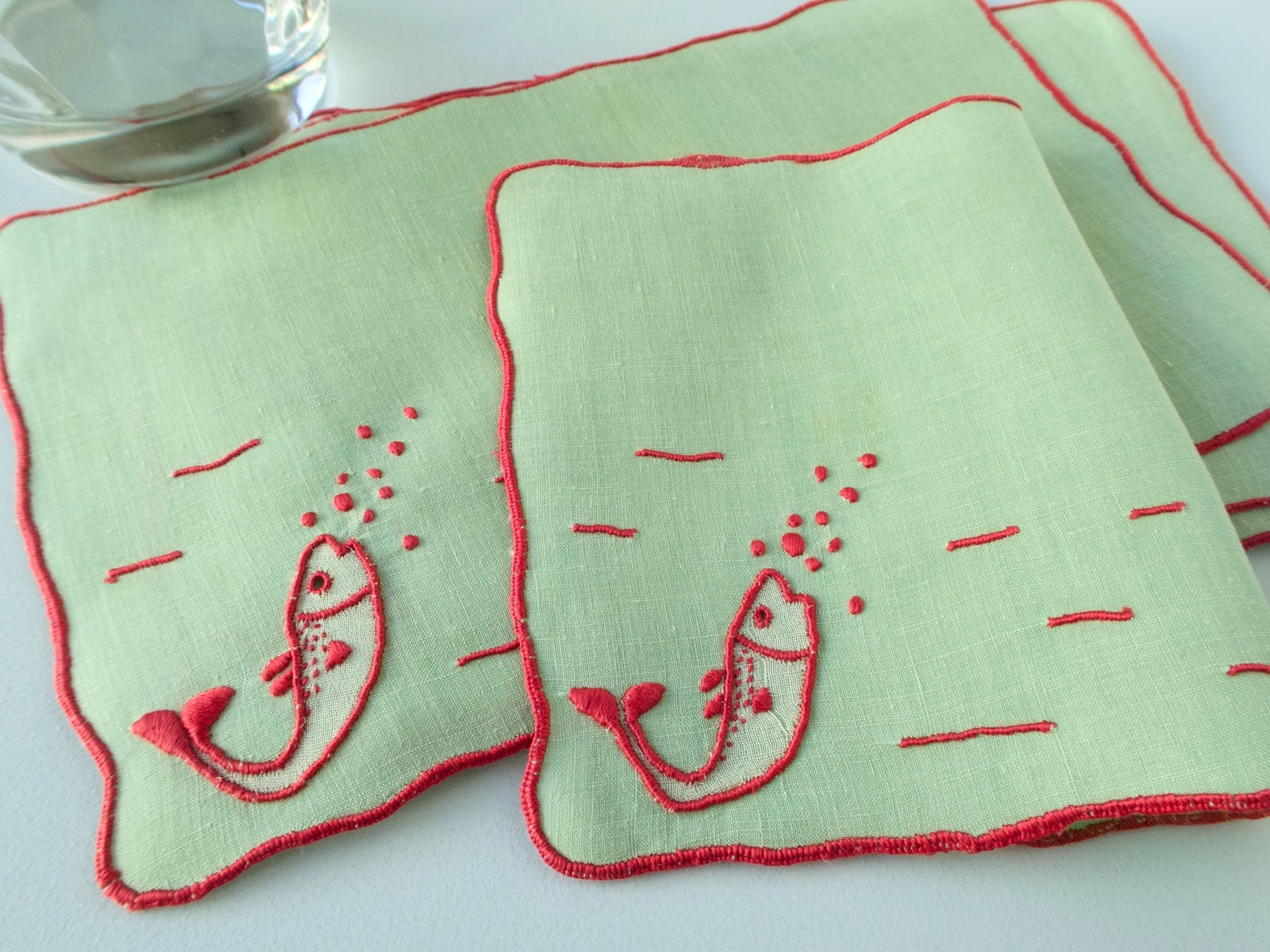 Vintage Marghab “Fish” pattern cocktail napkins, set of 6, red fish and bubbles hand embroidered on soft green Irish linen.