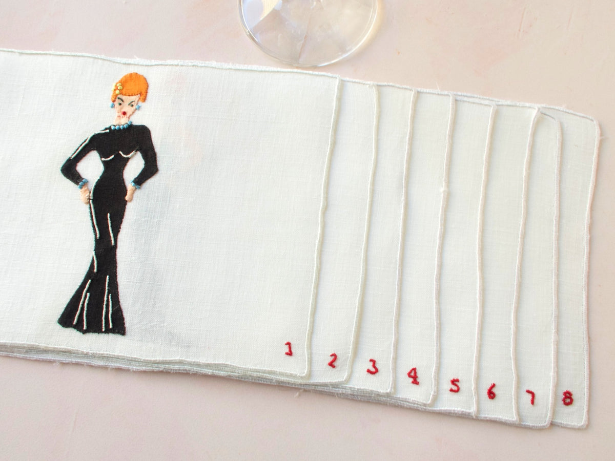 Unused vintage Madeira cocktail napkins featuring woman in black gown, hand embroidered mid-century linen