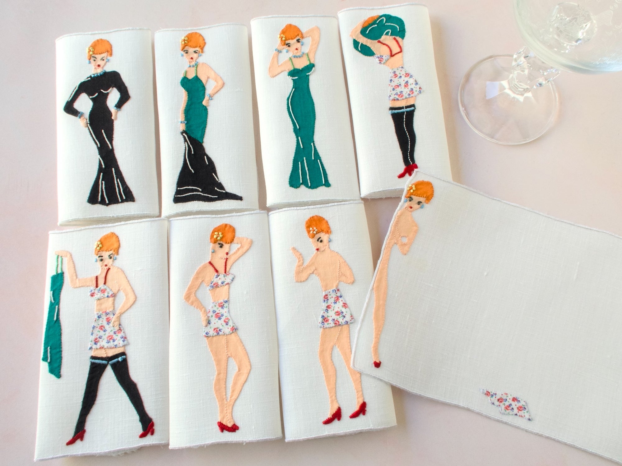 Set of eight vintage Madeira cocktail napkins showing embroidered striptease sequence