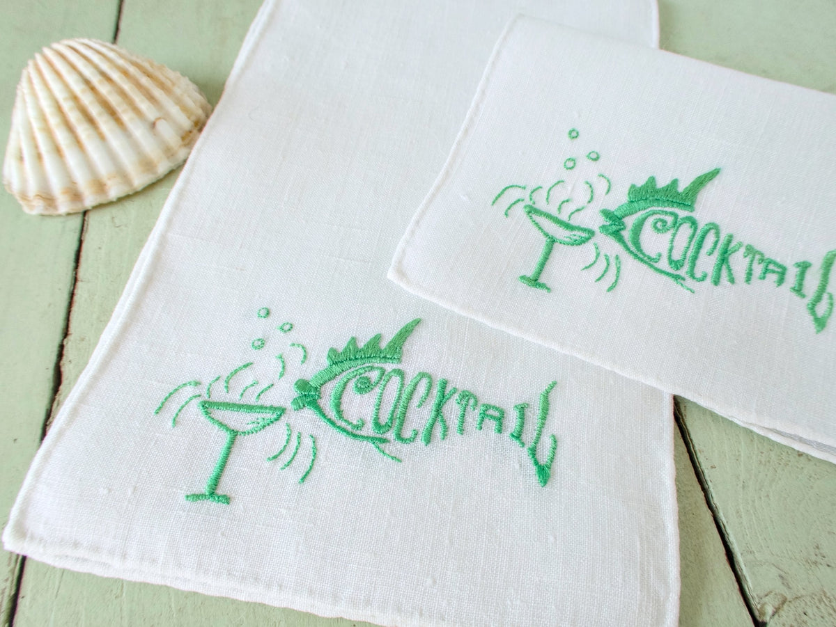 Vintage linen cocktail napkins, set of 6, with green machine embroidered cocktail glass and “COCKTAIL” text, slight antique patina.​​​​​​​​​​​​​​​​