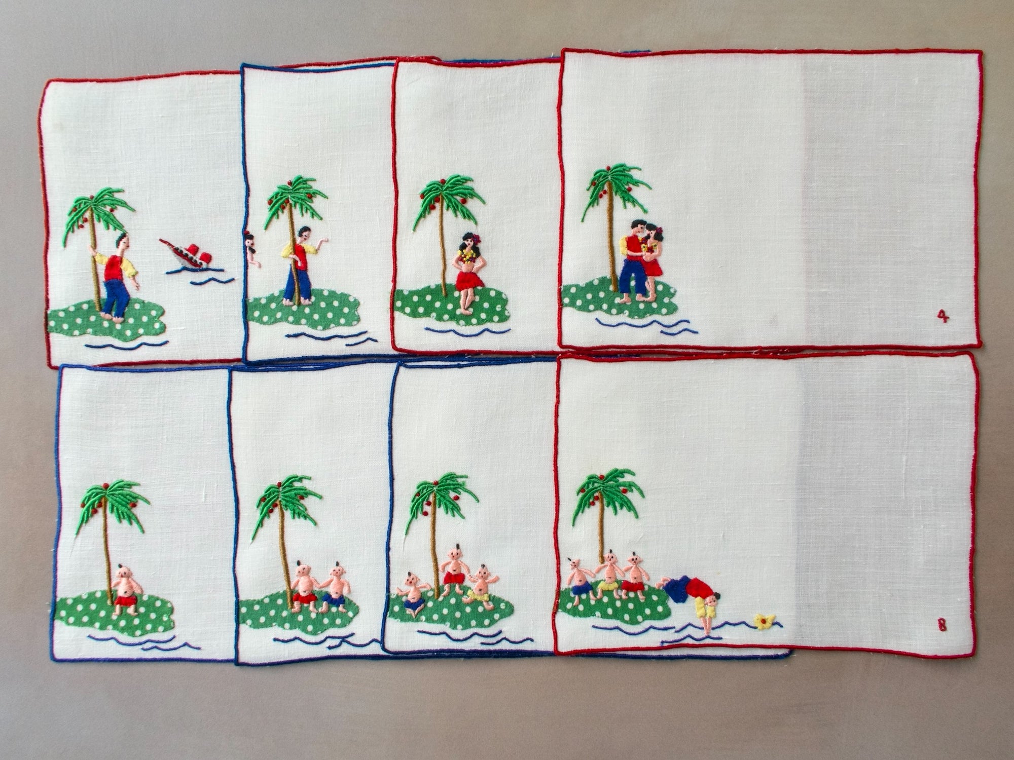 Eight vintage Madeira cocktail napkins showing a tropical island love story embroidered in bright colors.
