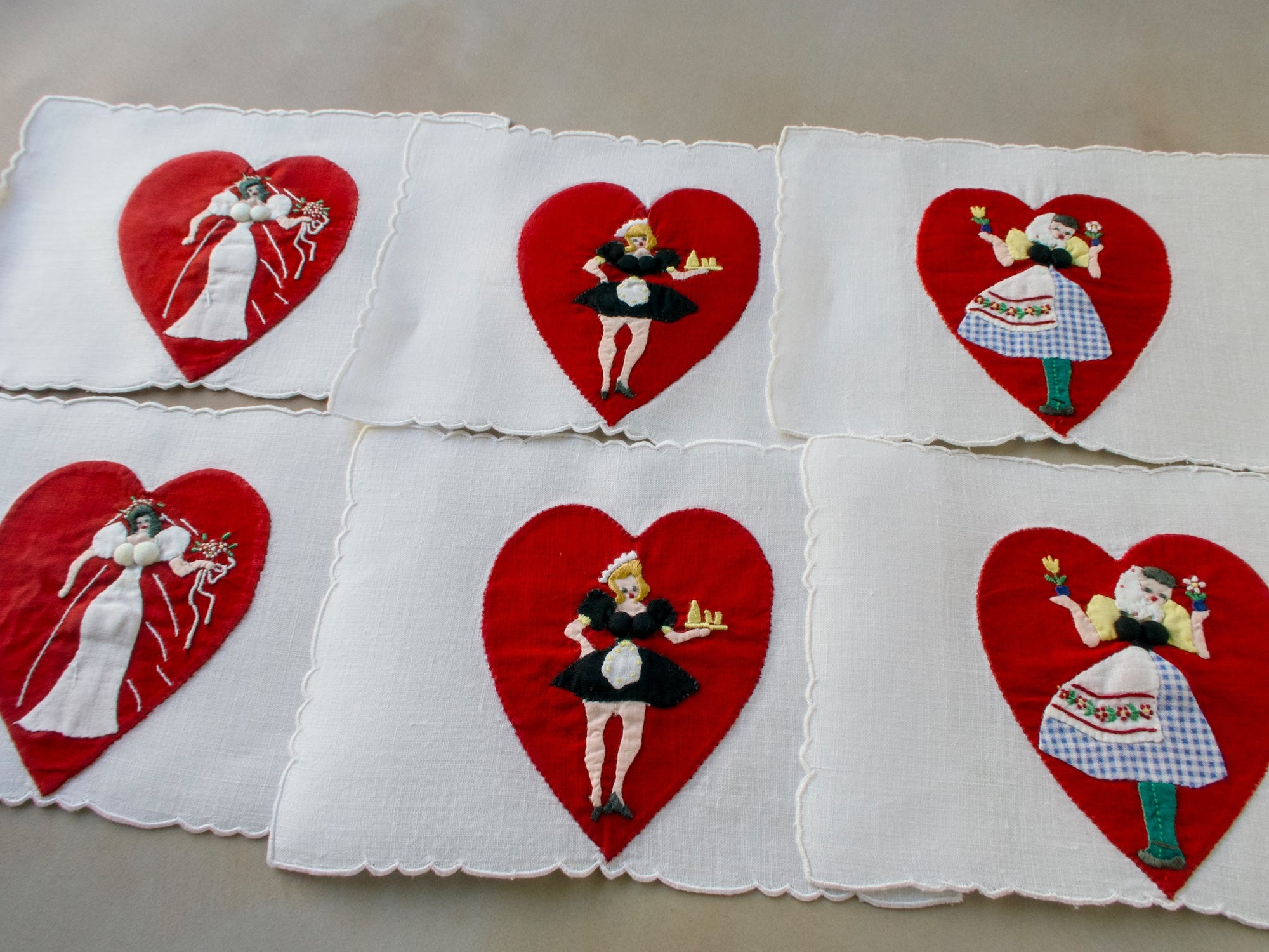 Vintage Madeira cocktail napkins featuring red hearts with pretty ladies on white linen