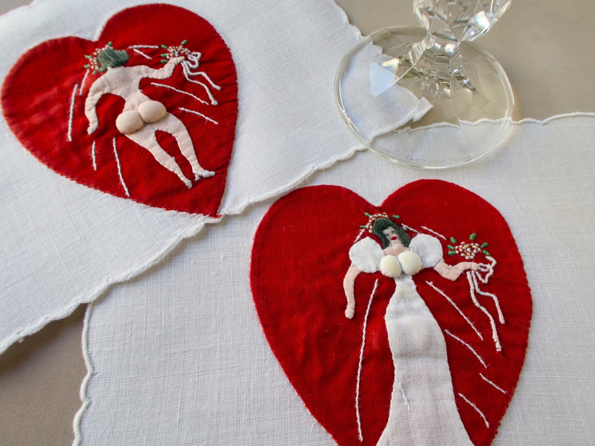 Vintage Madeira cocktail napkin with red heart appliqué and double-sided embroidered bride.
