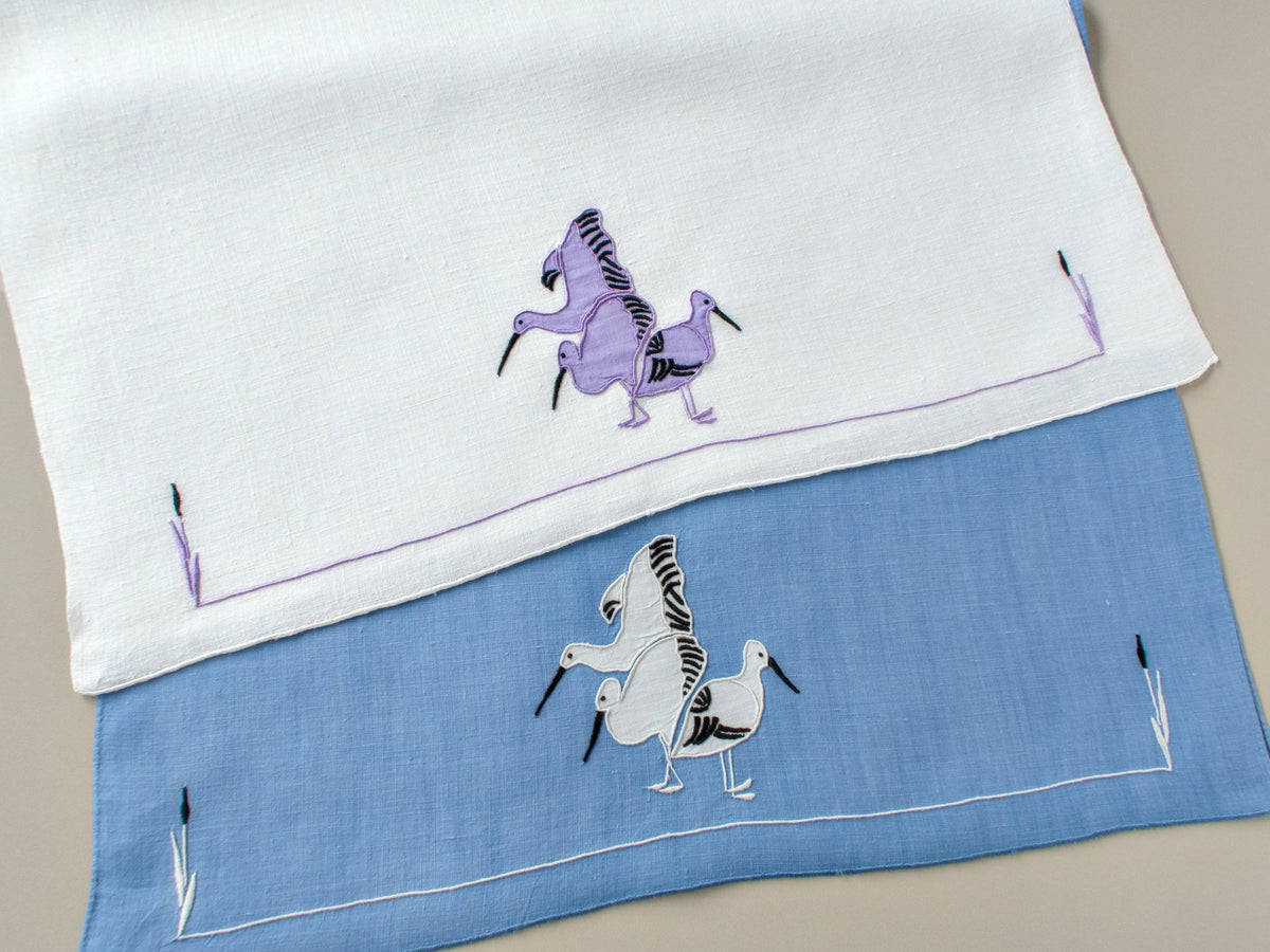 Vintage coordinating hand towels, set of 2, modernist water birds in appliqué with bullrushes, one white linen and one blue linen, mid-century design.
