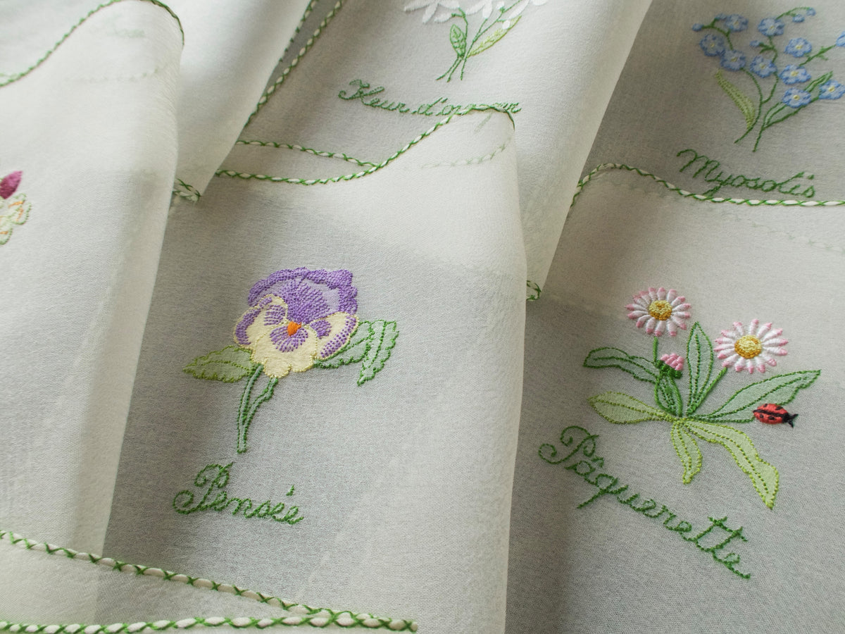 Vintage silk chiffon cocktail napkins hand embroidered with French flower names and delicate floral motifs.