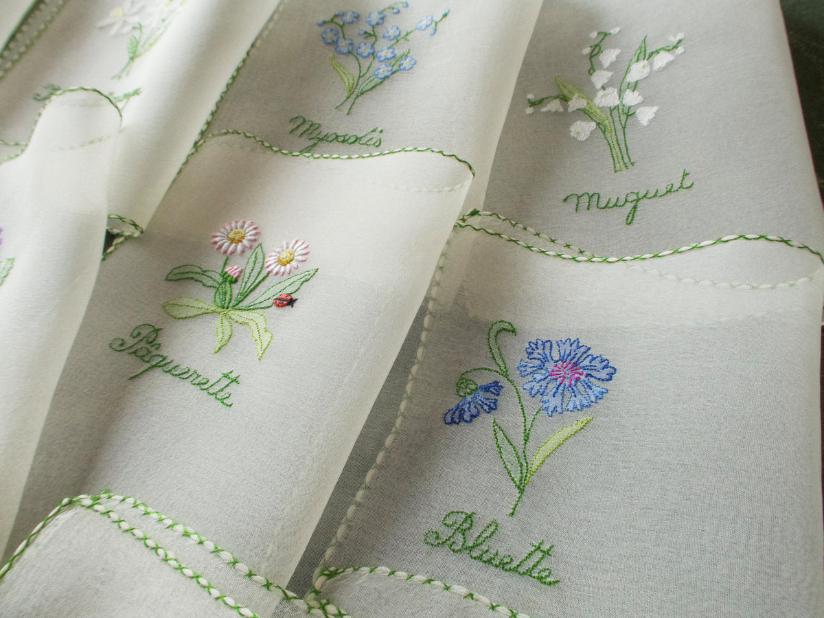 Vintage silk chiffon cocktail napkins hand embroidered with French flower names and delicate floral motifs.