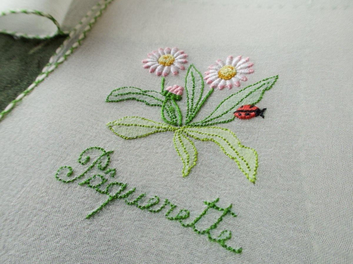 Vintage silk chiffon cocktail napkins hand embroidered with French flower names and delicate floral motifs.