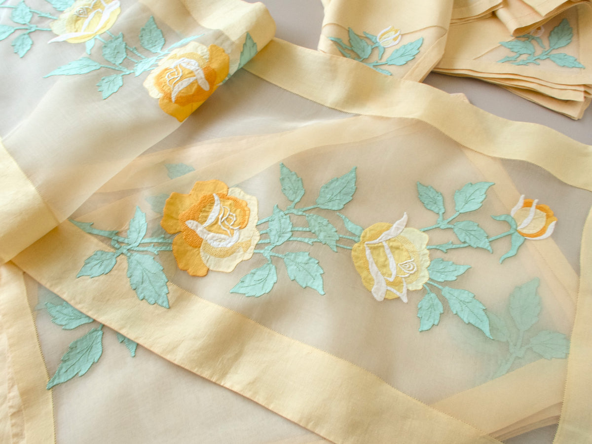 Vintage Madeira organdy table runner showing yellow rose and sage green leaf linen appliqué design