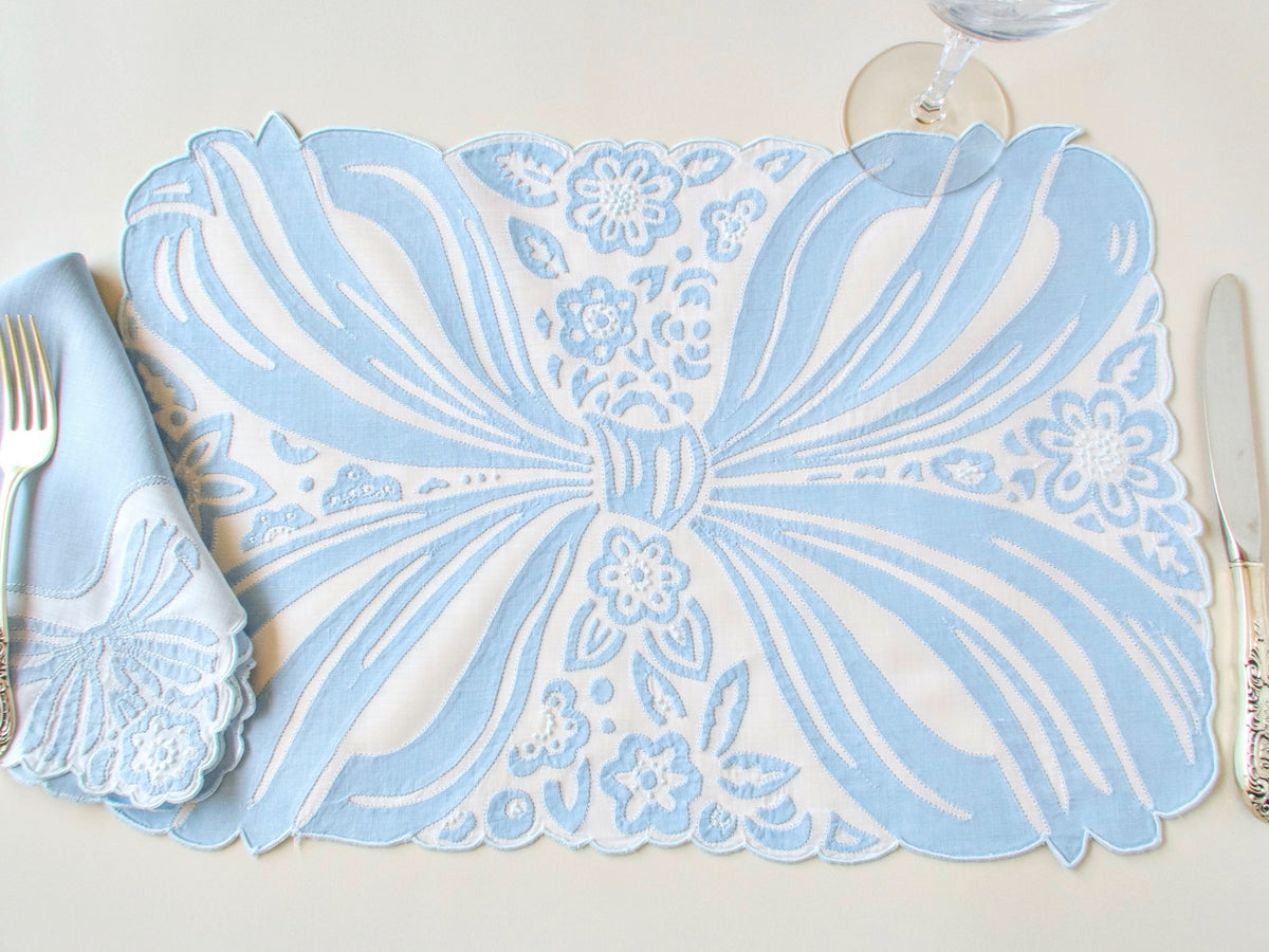 Ornate blue bow in embroidery and applique, vintage Madeira hand embroiderd placemat set.