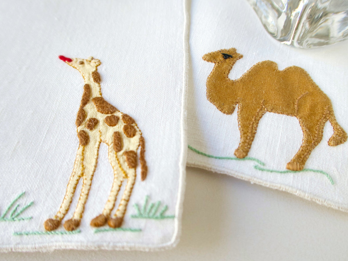 Vintage Madeira cocktail napkins, off-white Irish linen, appliqué camel and giraffe side by side
