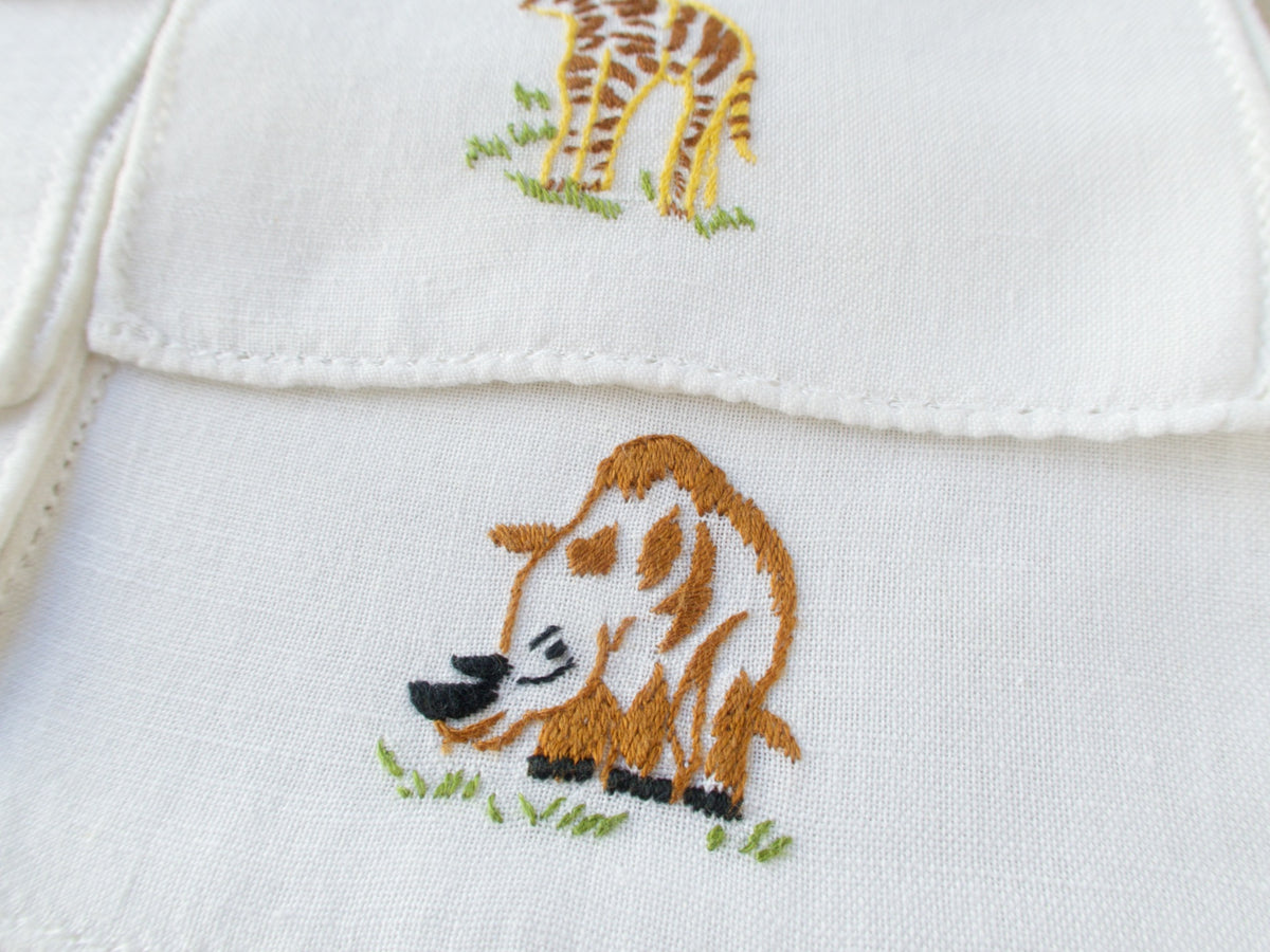 Close-up of vintage Italian cocktail napkin showing embroidered rhinoceros 