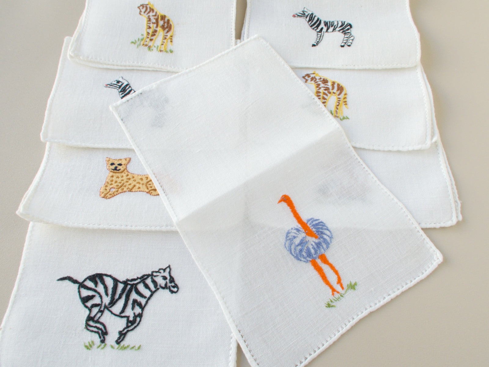 Vintage Italian cocktail napkins showing ostrich, zebra and leopard  embroidery details​​​​​​​​​​​​​​​​