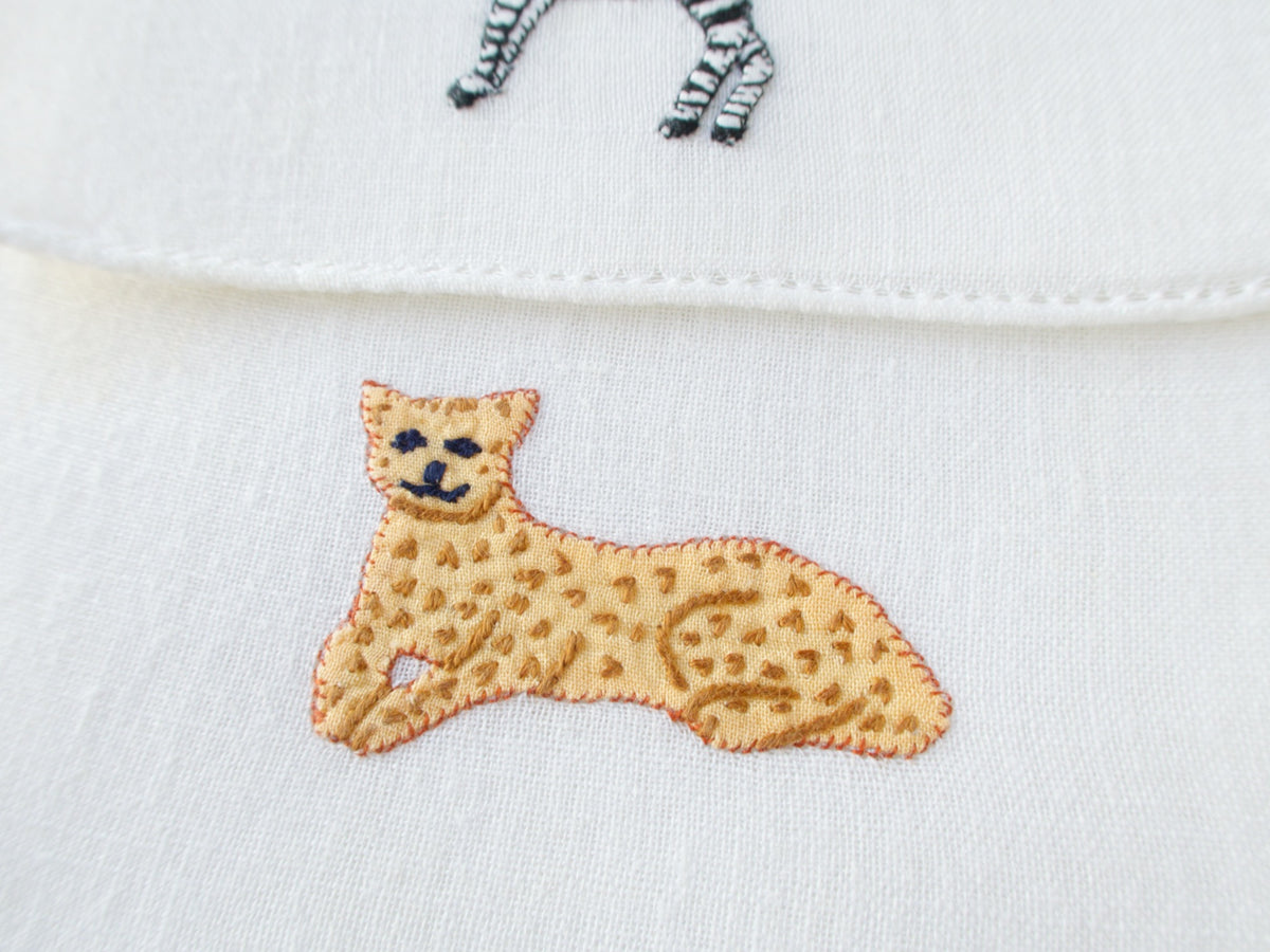 Vintage Italian cocktail napkin, detailed embroidered leopard lying down on white linen