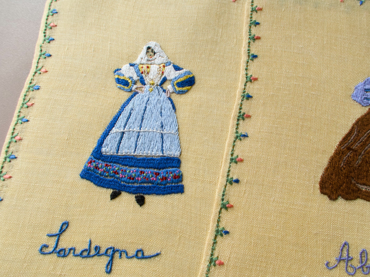 Rapisardi embroidered figure in traditional blue and white regional costume