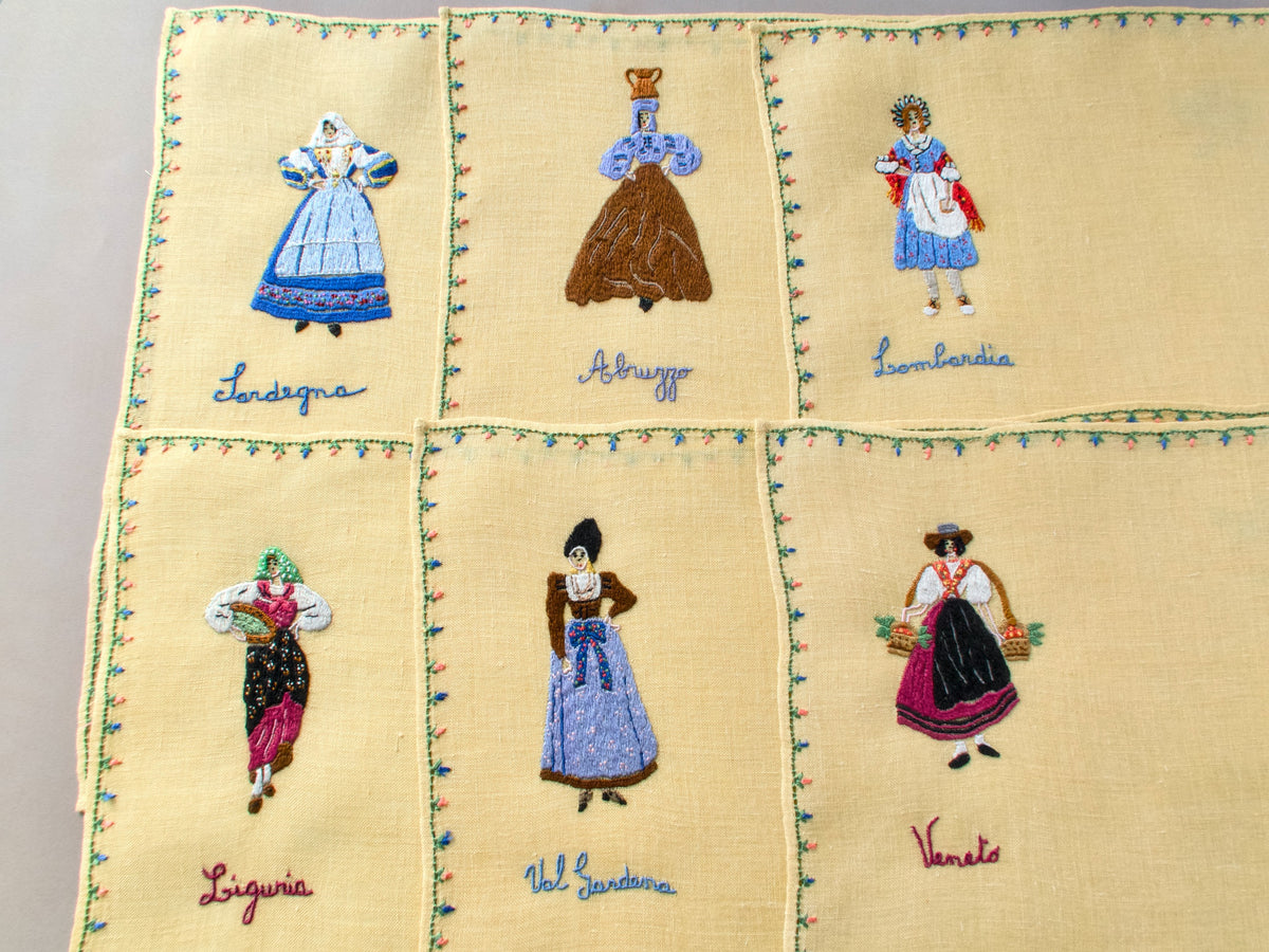 Assorted Rapisardi placemats with embroidered Italian regional costumes