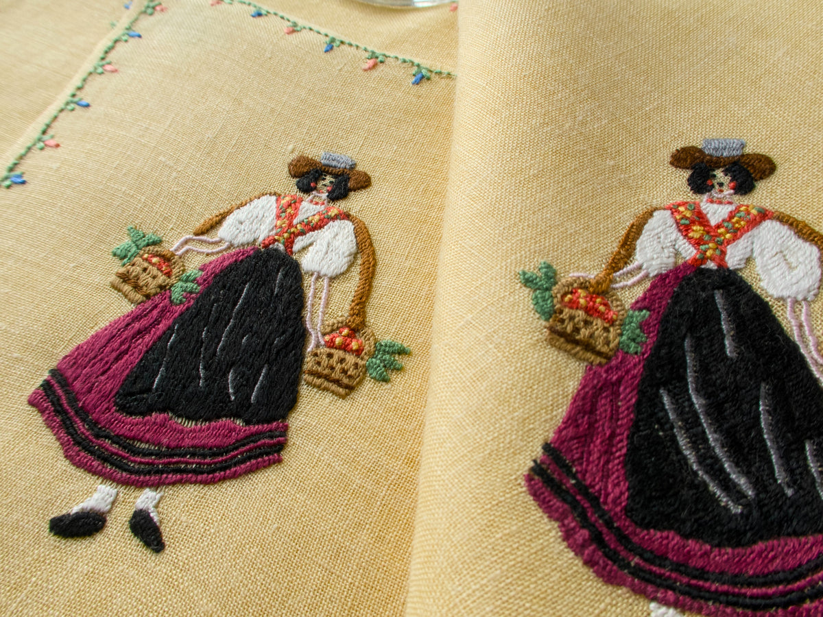 Rapisardi embroidered figure in red and black dress with floral accents